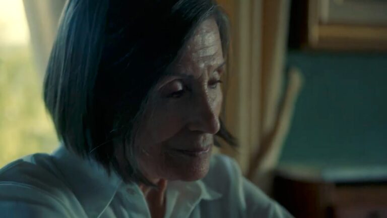 A woman looks sad and contemplative