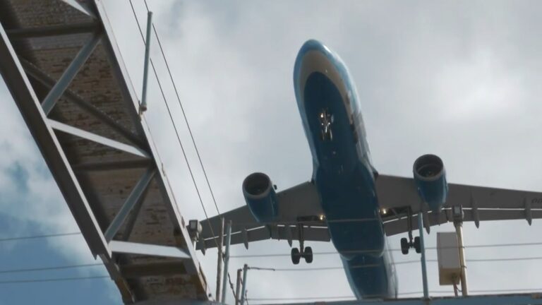 An airplane shown from beneath